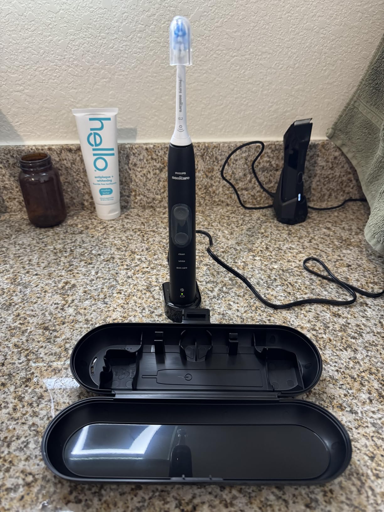 Philips Sonicare ProtectiveClean 5300 Rechargeable Electric Toothbrush, with Pressure Sensor, 3 Cleaning Modes, SmarTimer and QuadPacer, with 2 Bonus Brush Heads, Travel Case, Black, Model HX6423/34 customer photo 1
