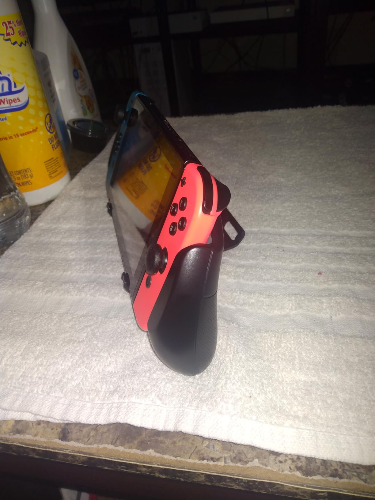 OIVO Switch Grip with Upgraded Adjustable Stand, Asymmetrical Grip with Adjustable Stand and 5 Game Slots-4 Thumb Caps Included customer photo 1