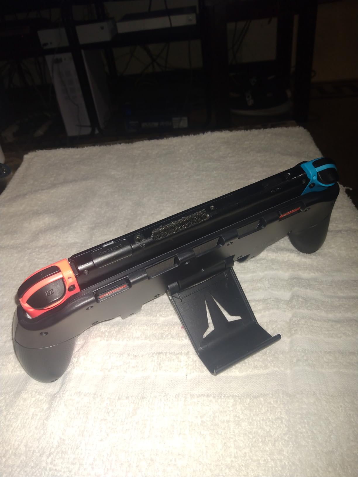 OIVO Switch Grip with Upgraded Adjustable Stand, Asymmetrical Grip with Adjustable Stand and 5 Game Slots-4 Thumb Caps Included customer photo 2