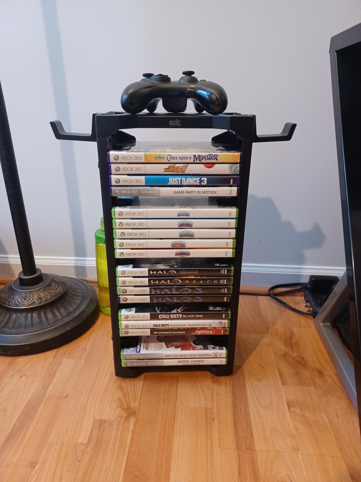 ADZ Universal Game Holder - 23 Game Storage Tower Rack for PS2 PS3 PS4 PS5 PSP Xbox 360 Xbox One Series X Wii Switch Games DVD and Blu-Ray Disks. Includes 2 Controller Mounts (Black) customer photo 1