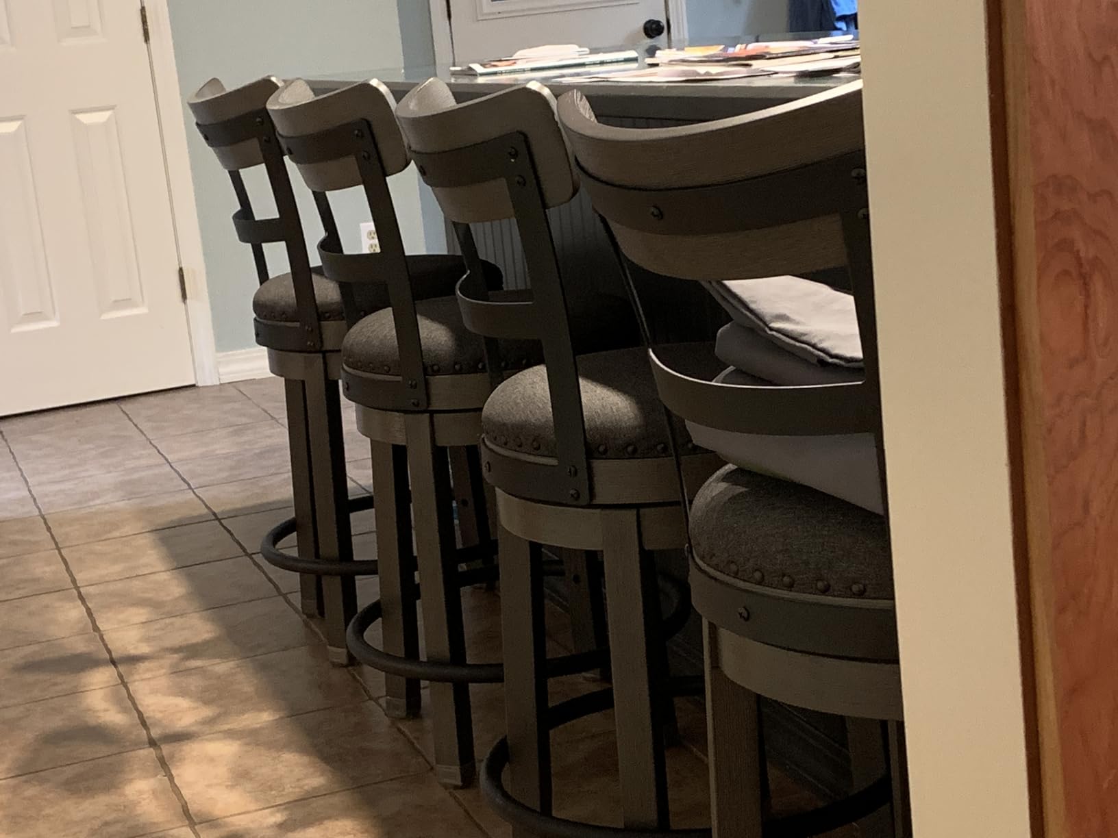 Signature Design by Ashley Pinnadel Counter Height Swivel Bar Stool, Brown | Wood, engineered wood & metal frame, Faux leather cushion, 24.25 inch seat, Smooth 360-degree rotation, Metal footrest customer photo 2