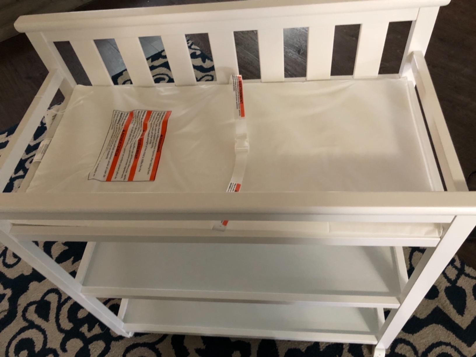Delta Children Flat Top Changing Table with Wheels and Changing Pad - Greenguard Gold Certified, Bianca White customer photo 1