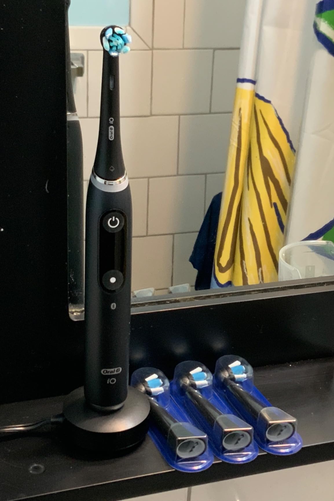 Oral-B Rechargeable Electric Toothbrush, iO Series 9 Genius, Black, 4 Replacement Brush Heads, Power Charging Travel Case, Teeth Whitening, Visible Pressure Sensor to Protect Gums, 7 Modes customer photo 1