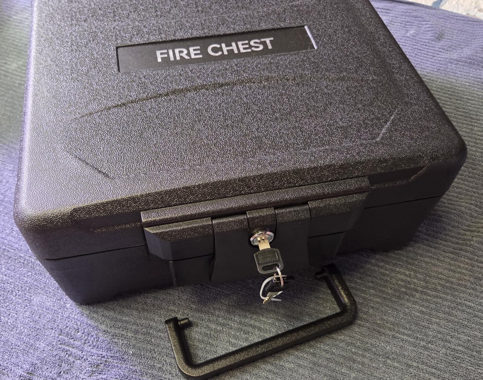 Amazon Basics Fire-Resistant Waterproof Fire Chest with Mechanical Key, Protects During Floods, 0.39 cu. ft, Black customer photo 1