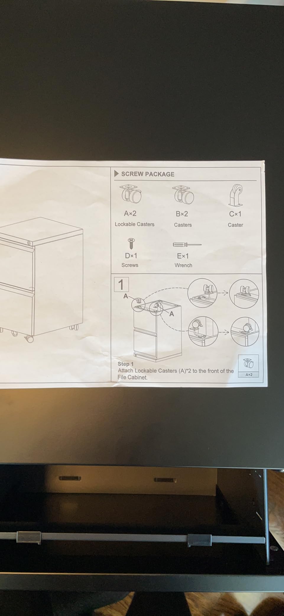 4 Drawer Metal File Cabinet with Lock and Wheels, Black | Lockable narrow vertical filing cabinet with anti-tilt interlock; fits letter/legal hanging folders; assembly required. customer photo 1