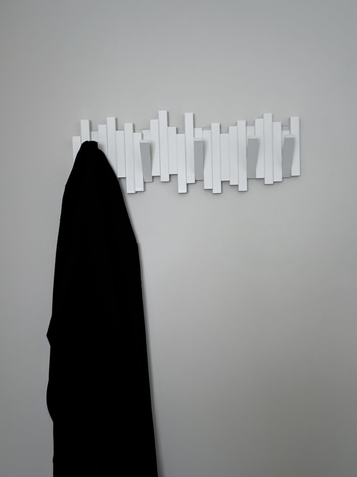 Umbra Sticks Wall Mount Coat Rack, 5 Hook Retractable Pegs, Black | Mounting hardware included, sculptural modern design, entryway or bedroom use, recycled plastic customer photo 1