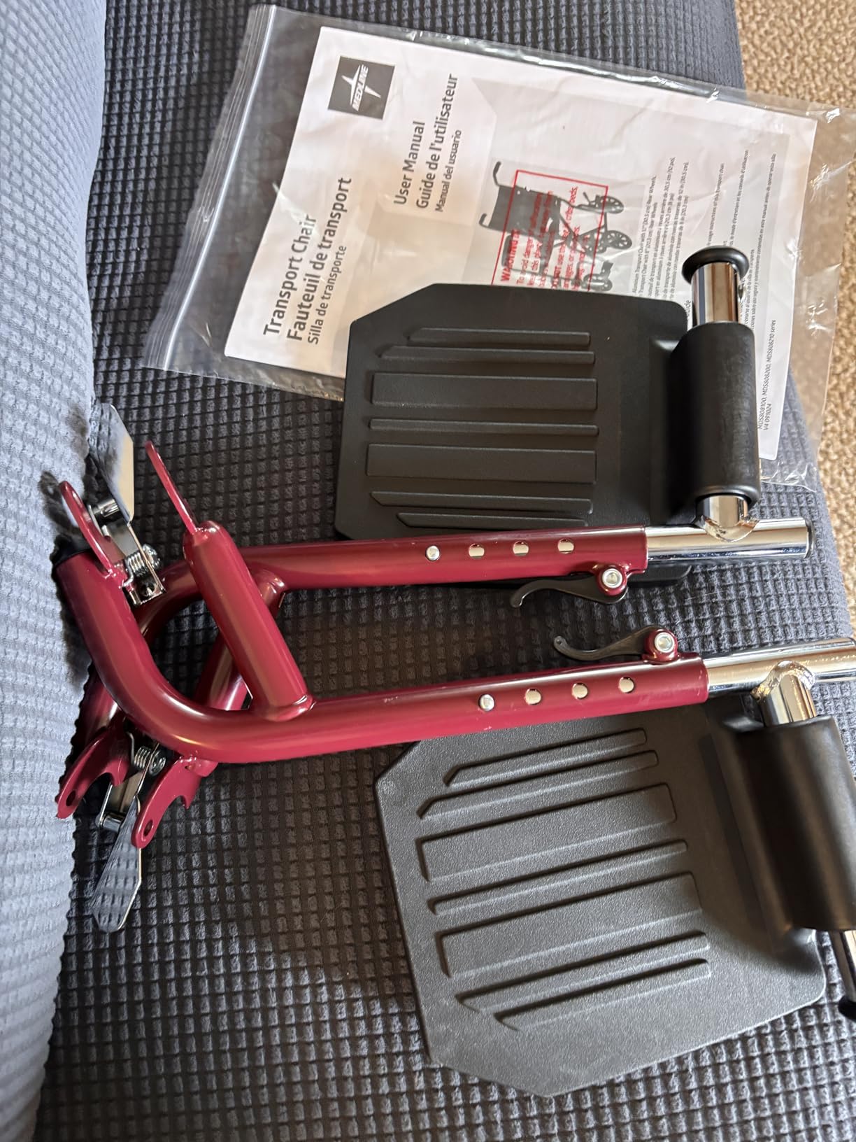 Medline Lightweight Foldable Transport Wheelchair with Handbrakes and 12-Inch Wheels, Red Frame, Black Upholstery customer photo 1