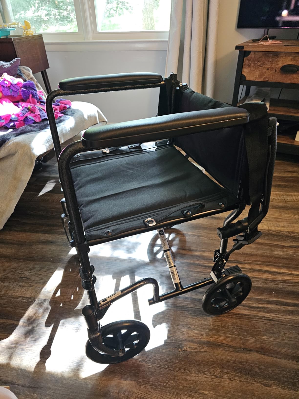 Medline Durable Folding Steel Transport Wheelchair with Swing-Away Footrests, 19-Inch Seat Width, Black Frame, Black Upholstery customer photo 1