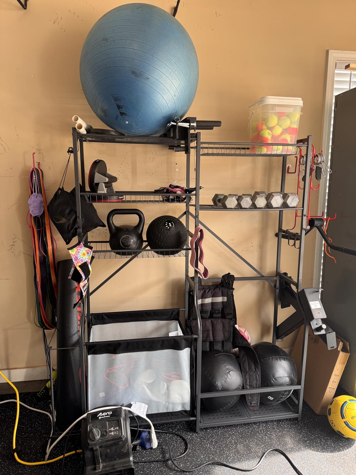 PLKOW Extra-Large Ball and Sports Equipment Storage Rack, Black | Stores 8-10 balls, 2 golf bags, shoes, weights, yoga mats, and sports gear with 1 adjustable wire basket customer photo 1