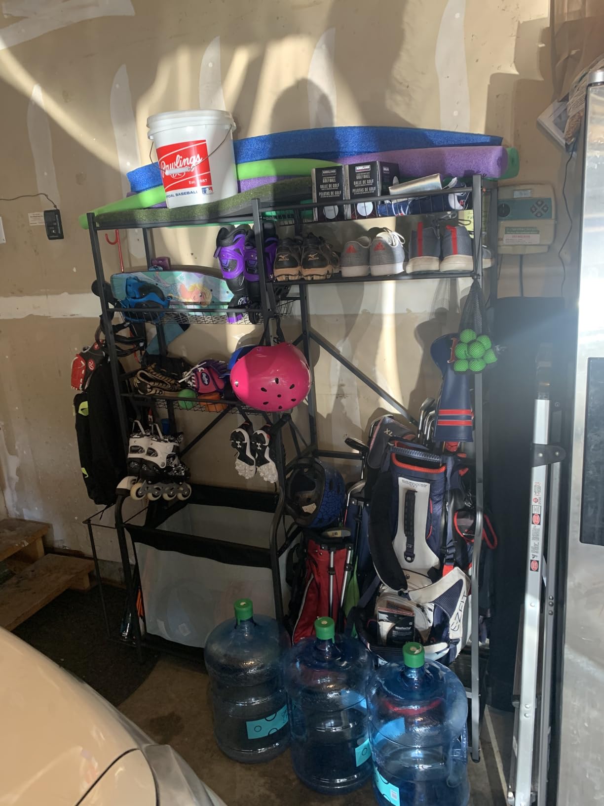 PLKOW Extra-Large Ball and Sports Equipment Storage Rack, Black | Stores 8-10 balls, 2 golf bags, shoes, weights, yoga mats, and sports gear with 1 adjustable wire basket customer photo 2