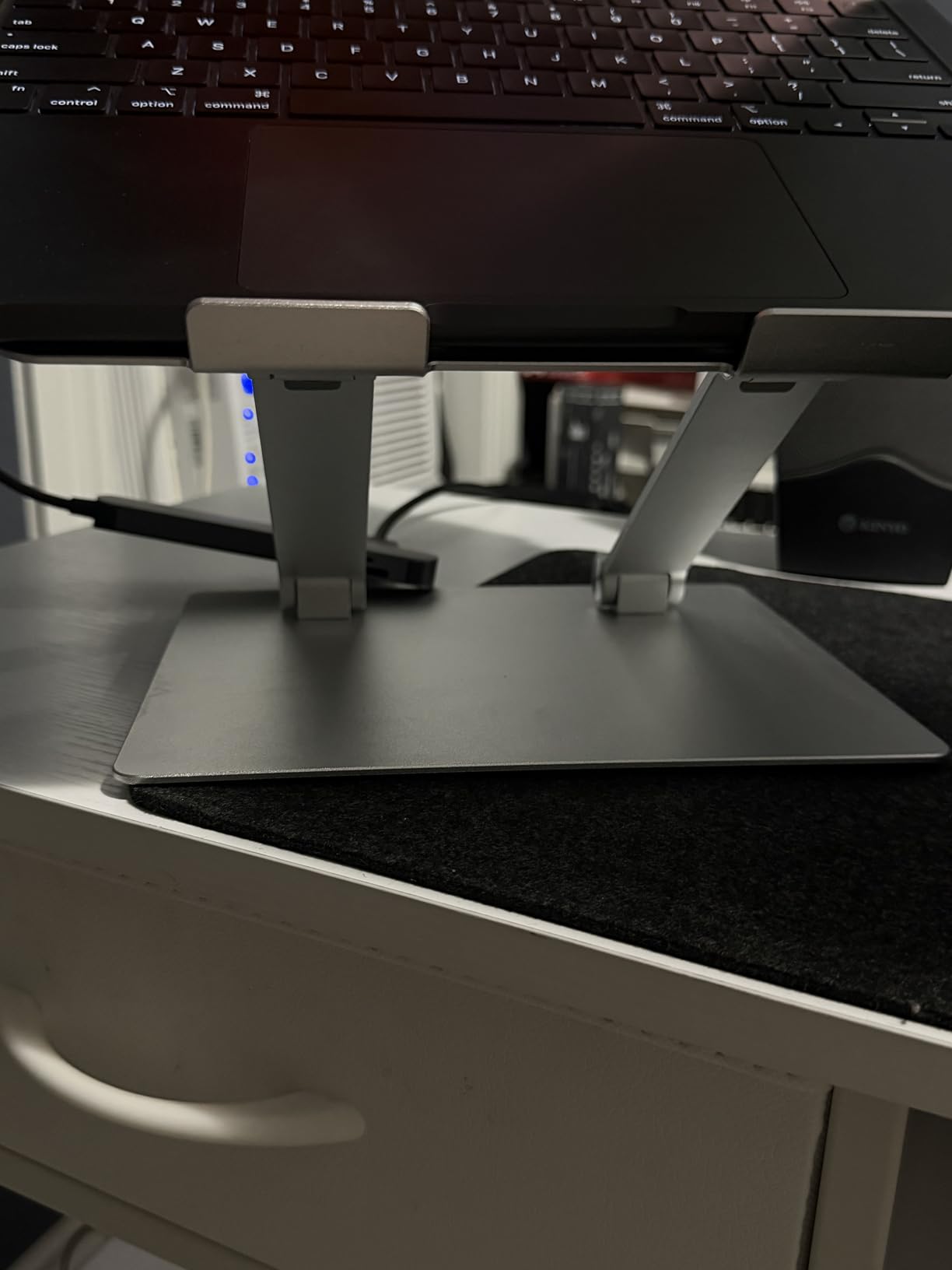 Amazon Basics Sturdy and Portable Ergonomic Laptop Stand for Desk, Height Adjustable Riser with Ventilated Cooling, Foldable, Fits all Laptops up to 15.6 Inch, Silver customer photo 2