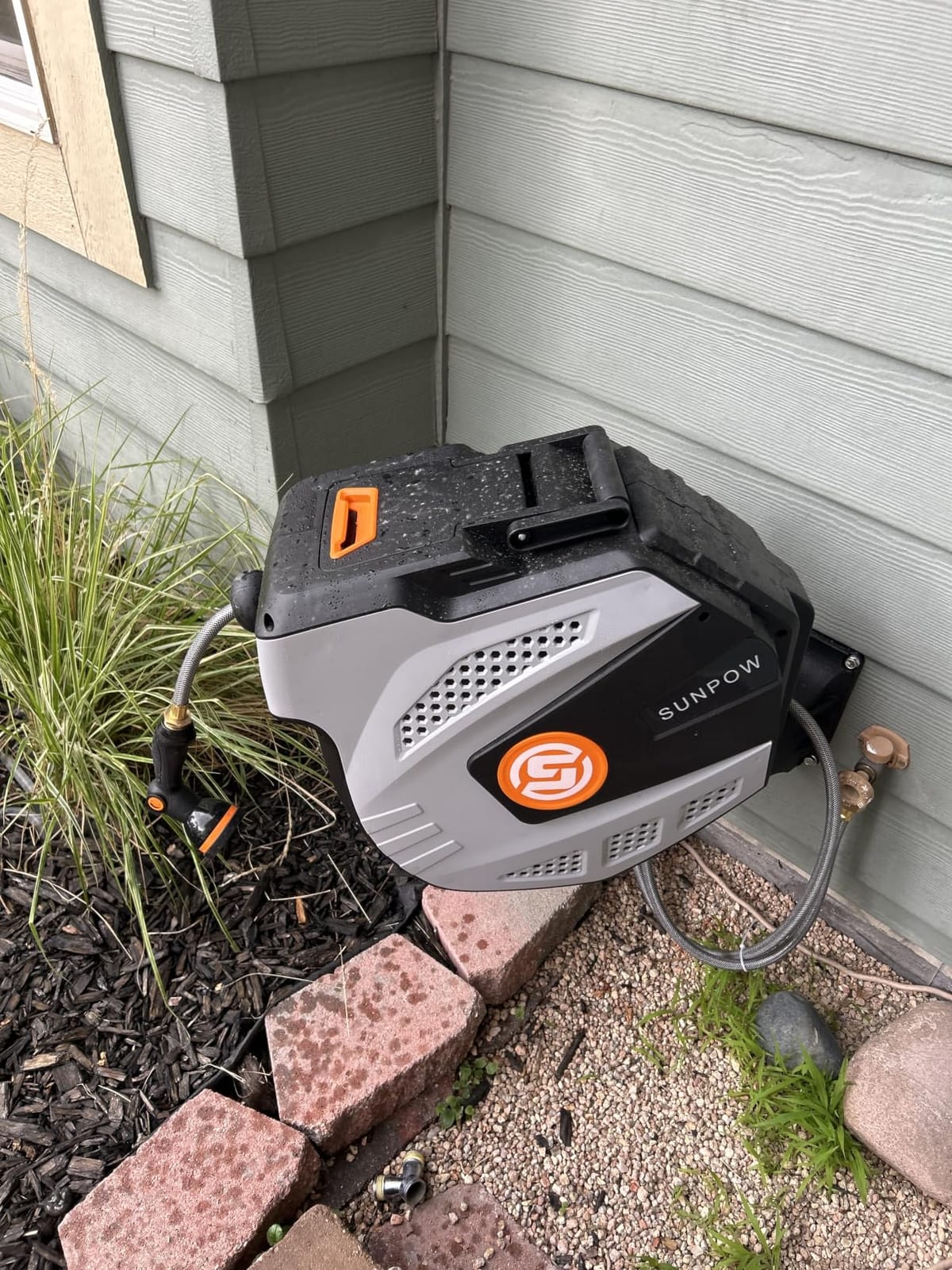 SUNPOW Retractable Garden Hose Reel - 1/2 inch x 50ft Heavy Duty Wall Mounted Hose Reel with 3/4 inch Brass Fitting & 10 Sprayer Nozzle, Any Length Lock, Auto Rewind System, 180° Swivel Bracket - Grey customer photo 1