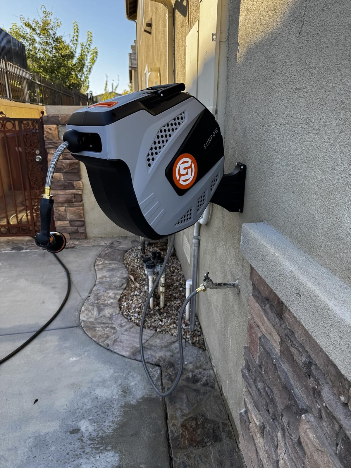 SUNPOW Retractable Garden Hose Reel - 1/2 inch x 50ft Heavy Duty Wall Mounted Hose Reel with 3/4 inch Brass Fitting & 10 Sprayer Nozzle, Any Length Lock, Auto Rewind System, 180° Swivel Bracket - Grey customer photo 2