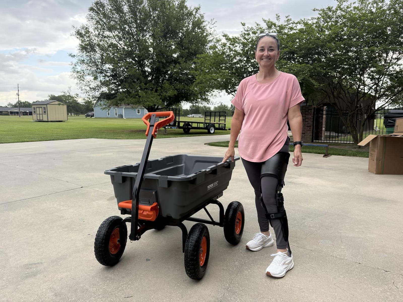 VEVOR Poly Garden Dump Cart 4 Cu.Ft. 600 lbs 4 Wheel Wheelbarrow Dump Wagon | For Orchard Farm, Adjustable Handle, Heavy Duty Yard Cart with 10 in All Terrain Wheels, Steel Frame & Quick Release System customer photo 2