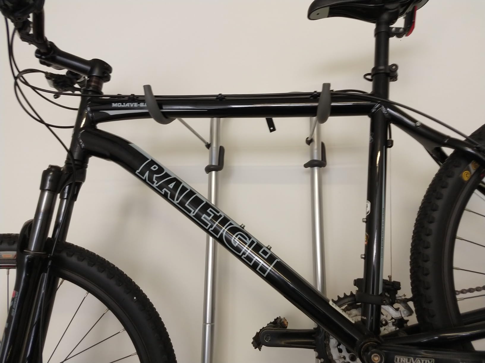 Delta Wall Ride Bike Rack Wall Mount with Tire Wall Guard Cycle - Vertical Bike Mount Holds Up to 100 lbs - Fully Adjustable Vertical Hanger Hook Design Provides Easy Bicycle Storage Access customer photo 2