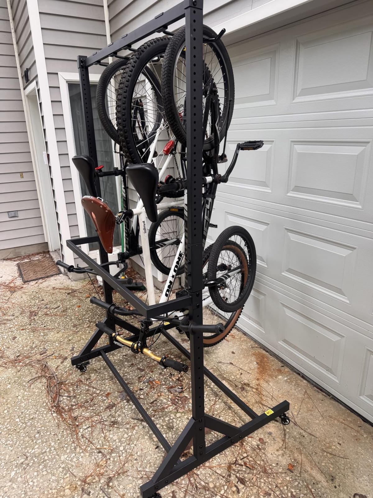 monTEK Rolling 4-Bike Rack Garage, Up to 4.5 in Tire Width | Heavy Duty, Holds up to 330 lbs, with 4 Bike Hooks and 6 Helmet Hooks, Bike Storage Rack with Locking Casters customer photo 1