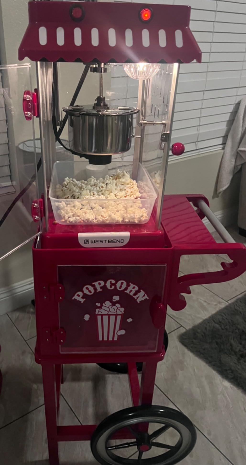 West Bend Popcorn Cart Vintage Theater Style with 2.5 oz Stainless Steel Kettle, Removable Serving Tray, Built-In Storage, Portable Design, 10 Cup Capacity, in Red/Silver customer photo 1